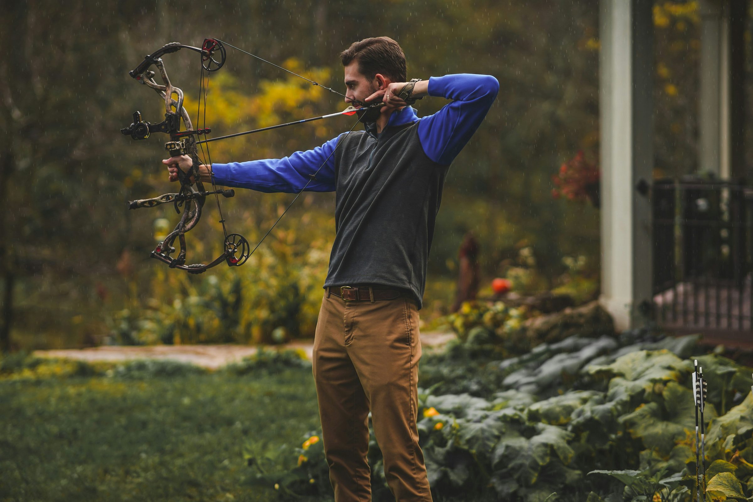 Archer practicing compound form at home in natural light